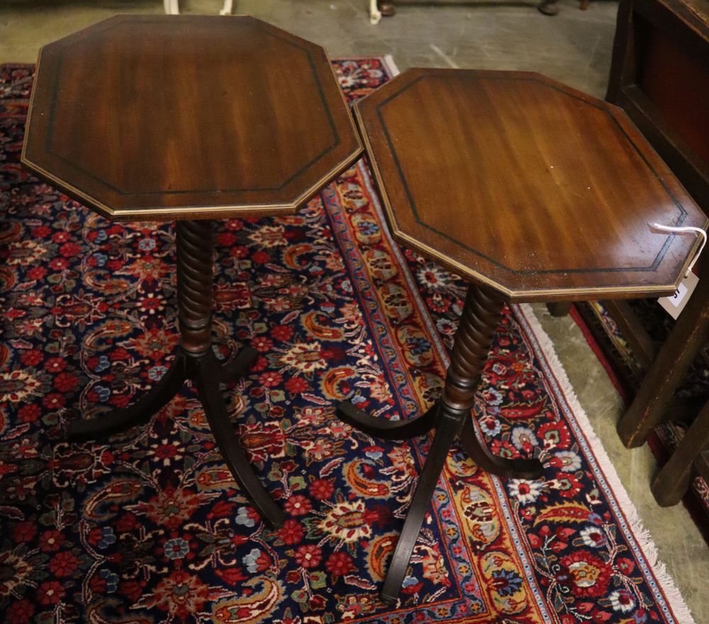 A pair of Regency design octagonal mahogany tripod wine tables, width 45cm, depth 39cm, height 75cm